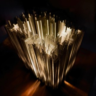Intricate 3D-printed lamp with geometric patterns highlighting innovative lighting solutions.