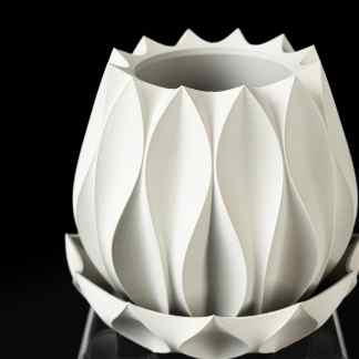 Elegant 3D-printed white lamp featuring petal-inspired design, perfect for contemporary interior decor.