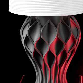 Close-up of a modern, intricately designed 3D-printed vase in black and red, showcasing advanced additive manufacturing techniques.