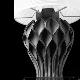Highly detailed black and white 3D-printed table lamp, showcasing innovative design and 3D printing technology.