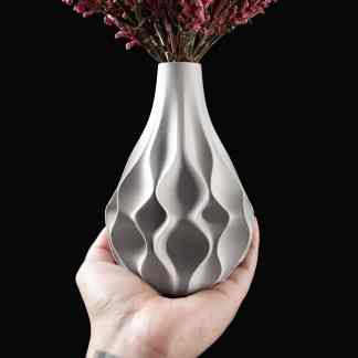 Elegant 3D textured metallic vase for stylish home decoration and floral arrangements.