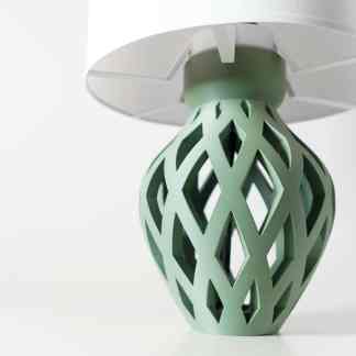 A stylish green 3D printed vase showcasing advanced additive manufacturing technology and decorative design.