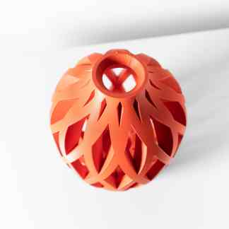 Highly detailed 3D-printed orange geometric design, showcasing advanced additive manufacturing.