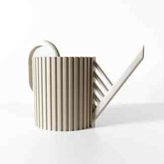 Mini beige watering can with ribbed body, perfect for indoor plants and decorative gardening.