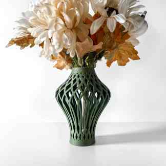 Detailed 3D-printed green vase with lattice pattern holding artificial flowers, showcasing innovative design and craftsmanship.