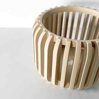 3D printed wooden object with sleek, modern design, perfect for jewelry or decorative use.