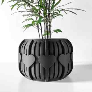 Stylish black 3D-printed plant pot featuring heart-shaped accents, ideal for contemporary home decor.
