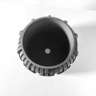 Close-up of a black metal gear for 3D printing, showcasing detailed manufacturing accuracy.