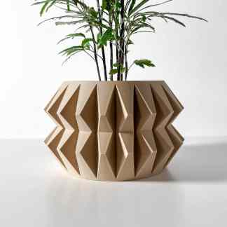 Detailed view of a beige 3D-printed geometric plant pot with a lush green plant, highlighting advanced 3D printing technology by AM Square 3D.