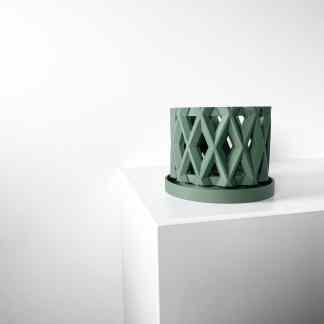 High-quality 3D printed green geometric container showcasing detailed design and precision craftsmanship.