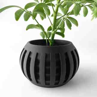 3D printed black flower pot with vertical slats, showcasing contemporary interior decor innovation.