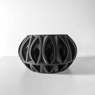 Advanced 3D printed vase showcasing complex geometric design in black filament.