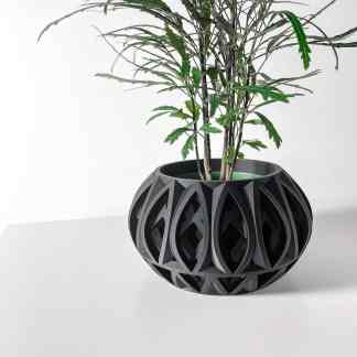A modern black 3D-printed geometric plant holder with intricate openwork design, perfect for stylish indoor decor.