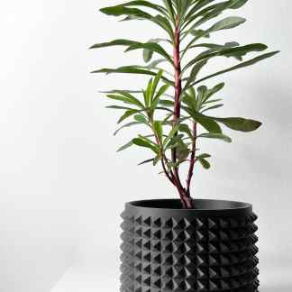 Vase with textured black 3D printed geometric pattern, perfect for modern interior spaces.