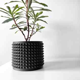 Elegant black planter with geometric textured surface perfect for stylish home decor.