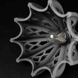Highly detailed 3D printed lamp with artistic design, featuring an LED bulb, perfect for contemporary home decor.