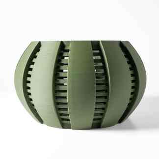 Detailed 3D printed geometric green sphere with lattice structure and modern design.