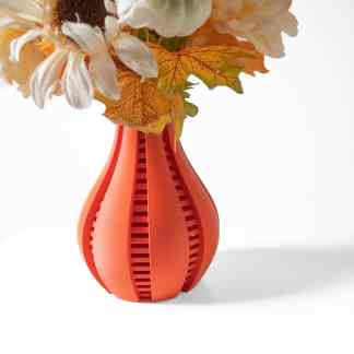 3D printed vase with colorful autumn leaves and flowers, showcasing innovative design and craftsmanship.