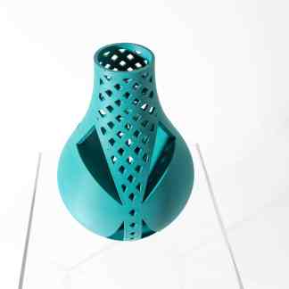Futuristic 3D-printed vase with intricate lattice design and vibrant blue color.