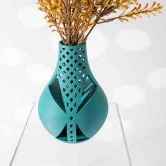 Vibrant blue 3D printed geometric vase with lattice pattern holding dried flowers.