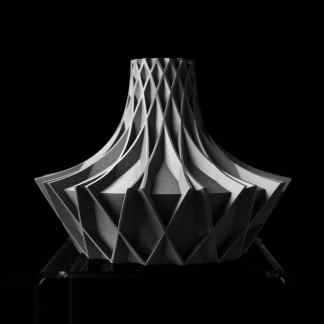 A black and white photo of a geometric 3D-printed sculpture showcasing modern design.
