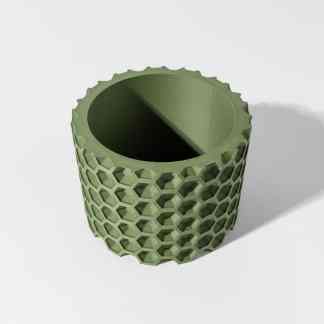 Detailed green hexagon-patterned 3D printed filament spool holder.