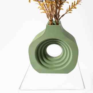 Stylish green 3D-printed vase with circular spiral pattern holding dried flowers for contemporary interiors.