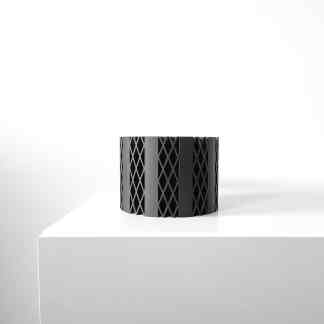 Bold 3D-printed black lattice design, modern art, innovative 3D printing technology showcase.