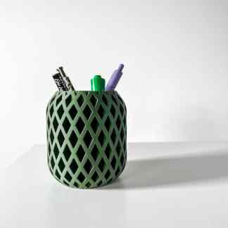 Stylish green 3D-printed pen holder for desk organization with geometric lattice pattern.