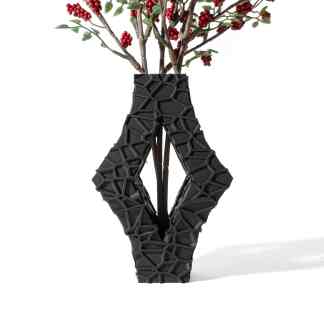 Vase with unique black 3D geometric design for flowers.