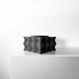 Elegant black 3D printed sculpture with a modern, abstract design for contemporary interiors.