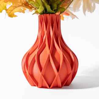 Vibrant coral-colored 3D-printed vase with intricate geometric patterns, perfect for home decor.