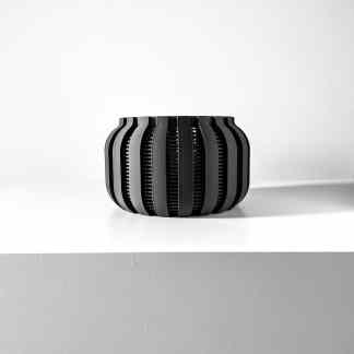 Stylish black 3D-printed vase showcasing modern design and intricate details, perfect for contemporary decor.