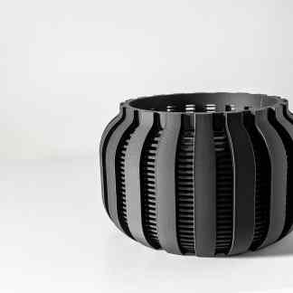 Sleek black 3D-printed vase showcasing intricate design, perfect for contemporary interior styling.