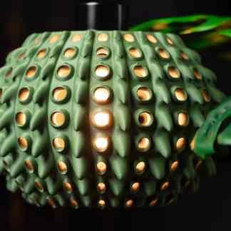 Colorful 3D printed lamp featuring innovative design and warm LED illumination.
