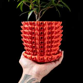 High-resolution 3D printed plant pot with intricate geometric patterns for modern decor.