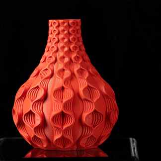 Colorful 3D printed decorative vase showcasing advanced fabrication technology.