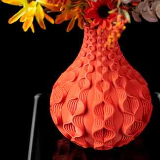 A striking red 3D-printed vase showcasing detailed craftsmanship and modern design, perfect for floral decoration.