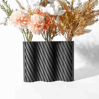 Eye-catching black 3D printed vase showcasing detailed texture and artistic floral arrangement.