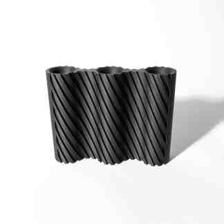 Intricate black geometric 3D printed sculpture with spiral pattern.