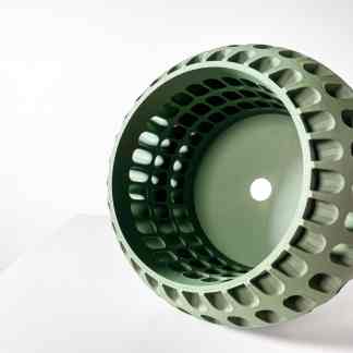 High-quality 3D printed industrial component with intricate internal lattice structure.