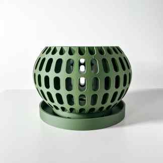 Bold green 3D printed vase with openwork geometric pattern and circular base.