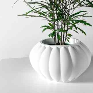 3D printed white flower pot with plant, showcasing advanced 3D printing technology.
