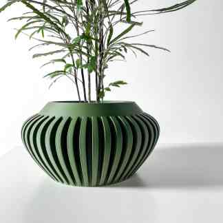 3D printed green decorative planter with unique slit pattern, perfect for showcasing indoor plants.