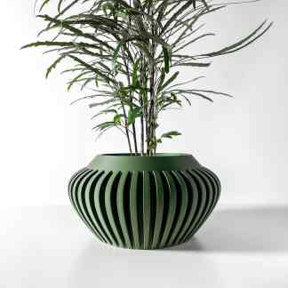 Elegant artificial plant with lush green leaves in a sleek, contemporary vase.