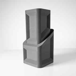 Stylish black and gray 3D printed speaker in sleek modern style.