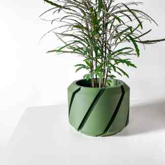 A stylish 3D-printed green plant pot featuring a contemporary geometric design, perfect for modern interior decor.
