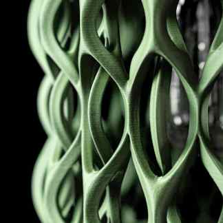 A close-up of a green 3D printed lattice structure highlighting intricate design and modern 3D printing technology.