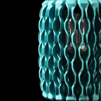Close-up of a modern, 3D-printed decorative lamp with intricate geometric lattice structure, showcasing advanced 3D printing technology.