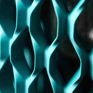 High-resolution 3D-printed architectural model showcasing advanced design techniques with teal finishes.